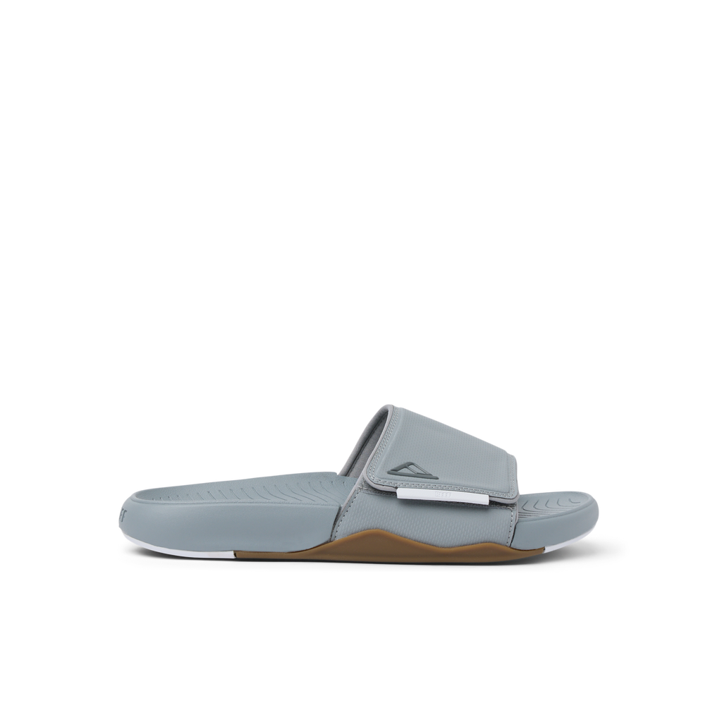 Phantom Slab men's right-facing grey slide with adjustable strap, soft cushioning, arch support, and water-friendly materials.