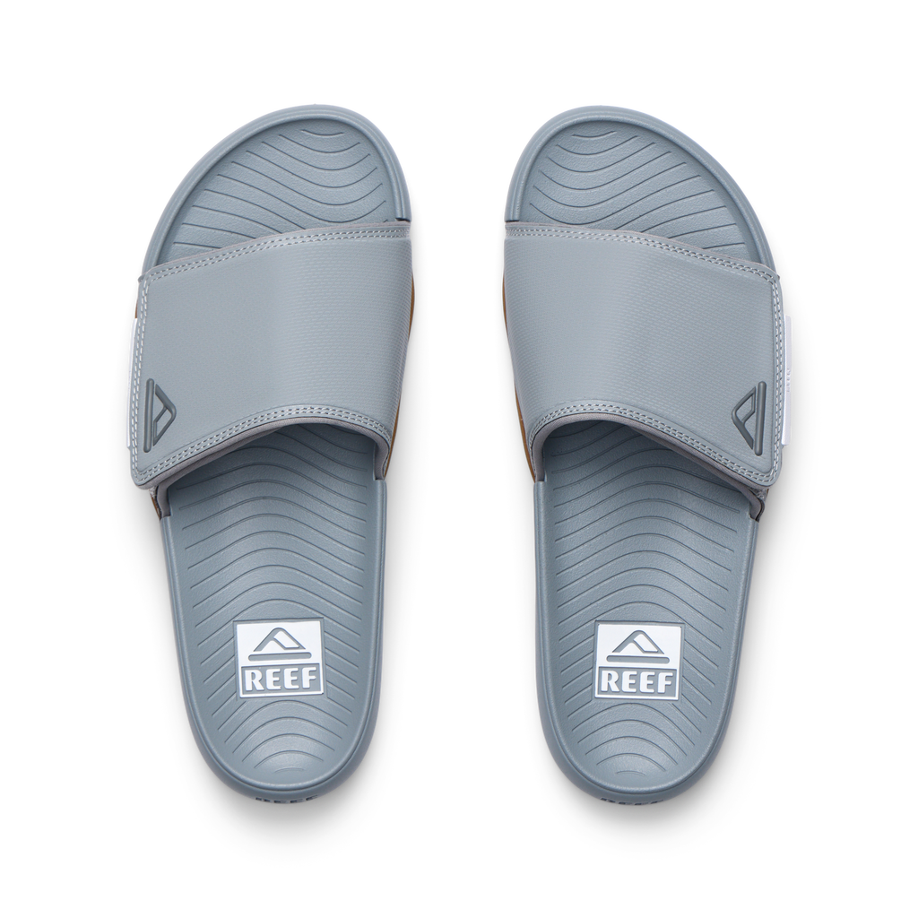 Phantom Slab men's slides in grey facing upward, featuring water-friendly materials and anatomical arch support for comfort.