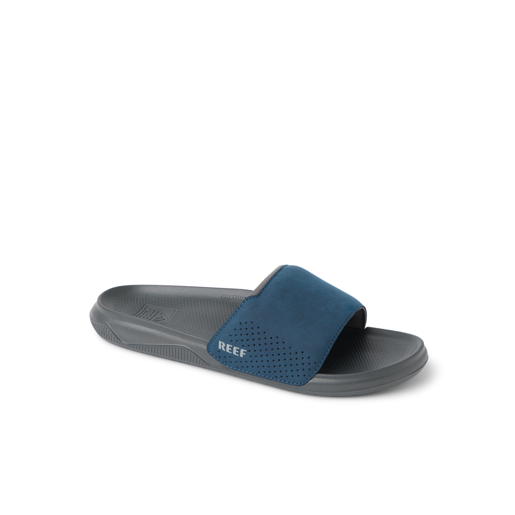 Tailslide men's slide sandal facing right with navy blue strap, anatomical arch support, and soft cushioning for comfort