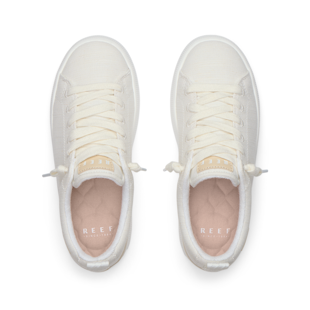 Top view of white Neptune Alana women's sneakers with textile upper, showing laces and cushioned insole for comfort.