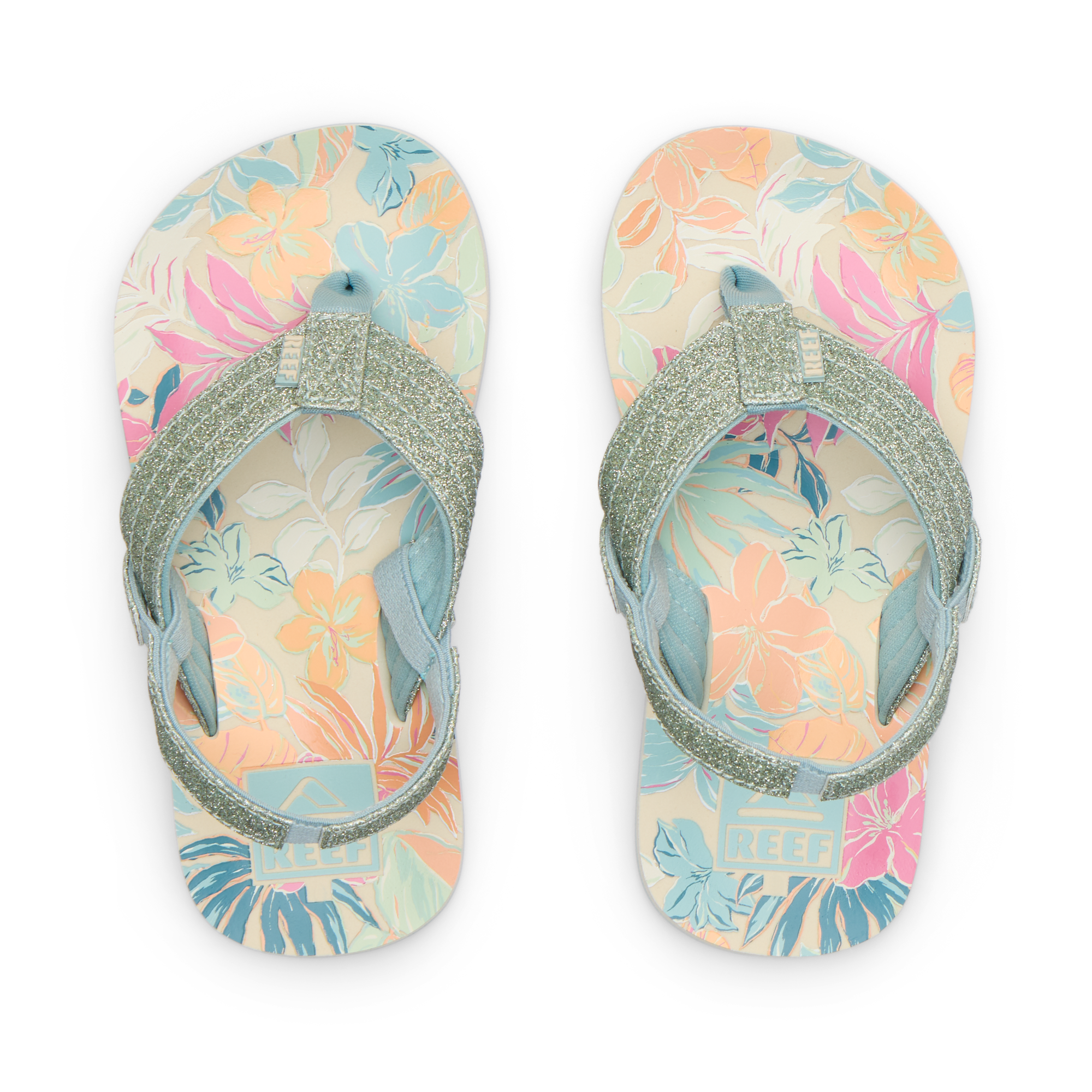 Top view of Little Ahi girls' sandals with tropical floral print footbed and glittery straps, designed for comfort and beach use.