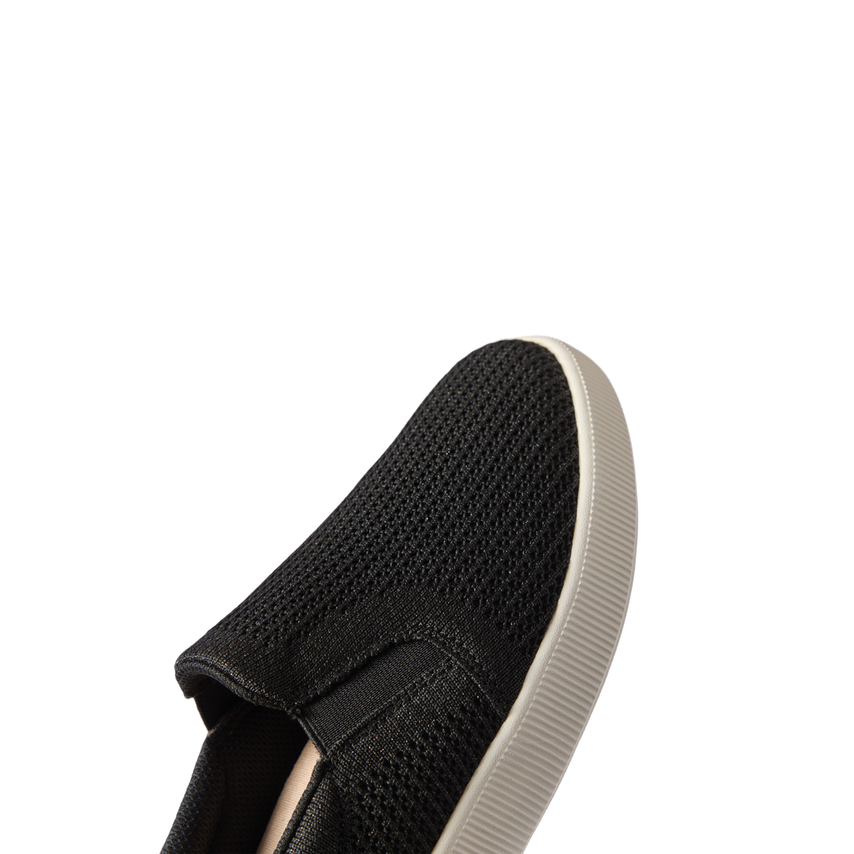 Neptune Elyse shoe facing left, close-up on breathable black mesh upper with white sole, designed for comfort and beach lifestyle.