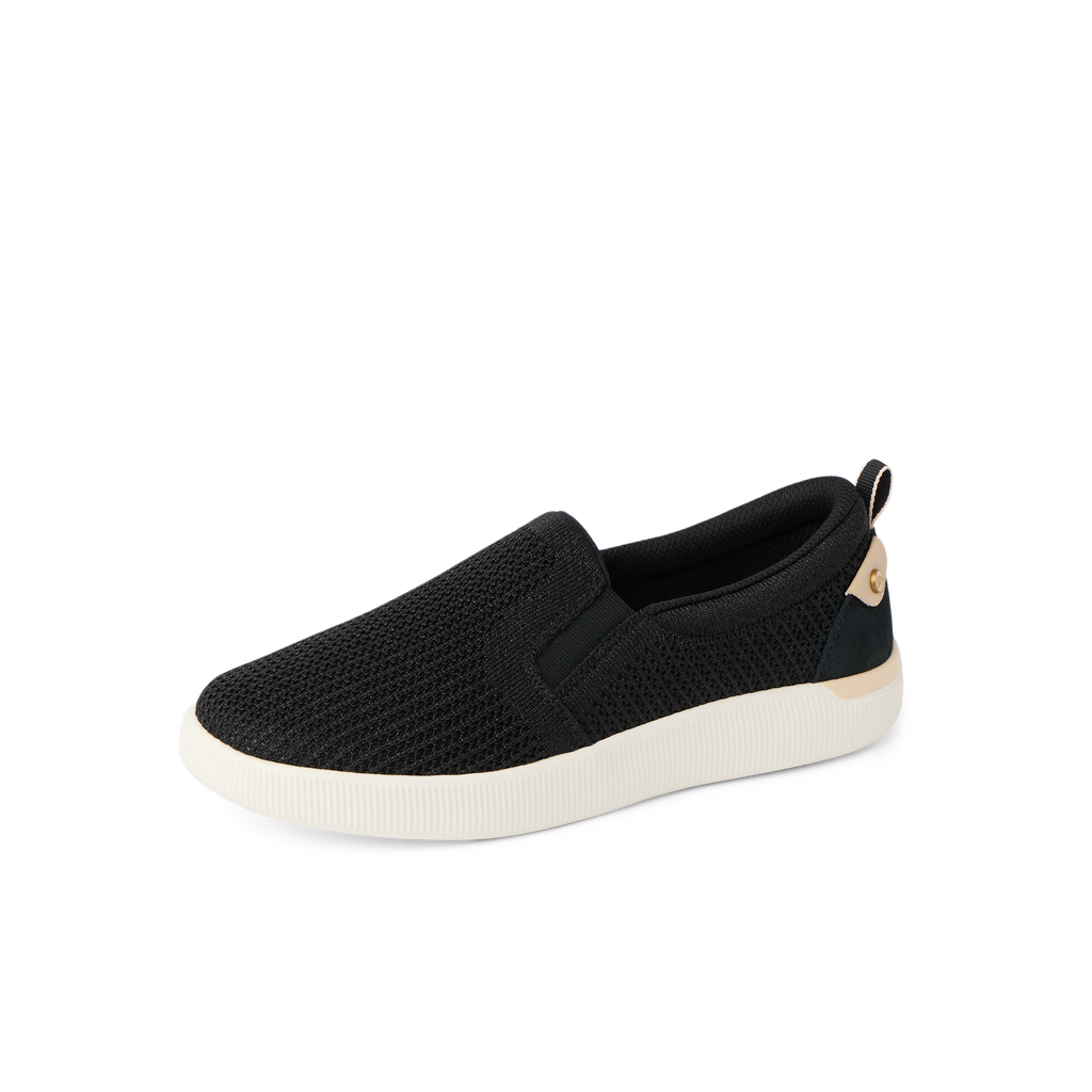 Neptune Elyse women's black slip-on shoe facing left, breathable knit, cushioned sole, beach-inspired comfort footwear