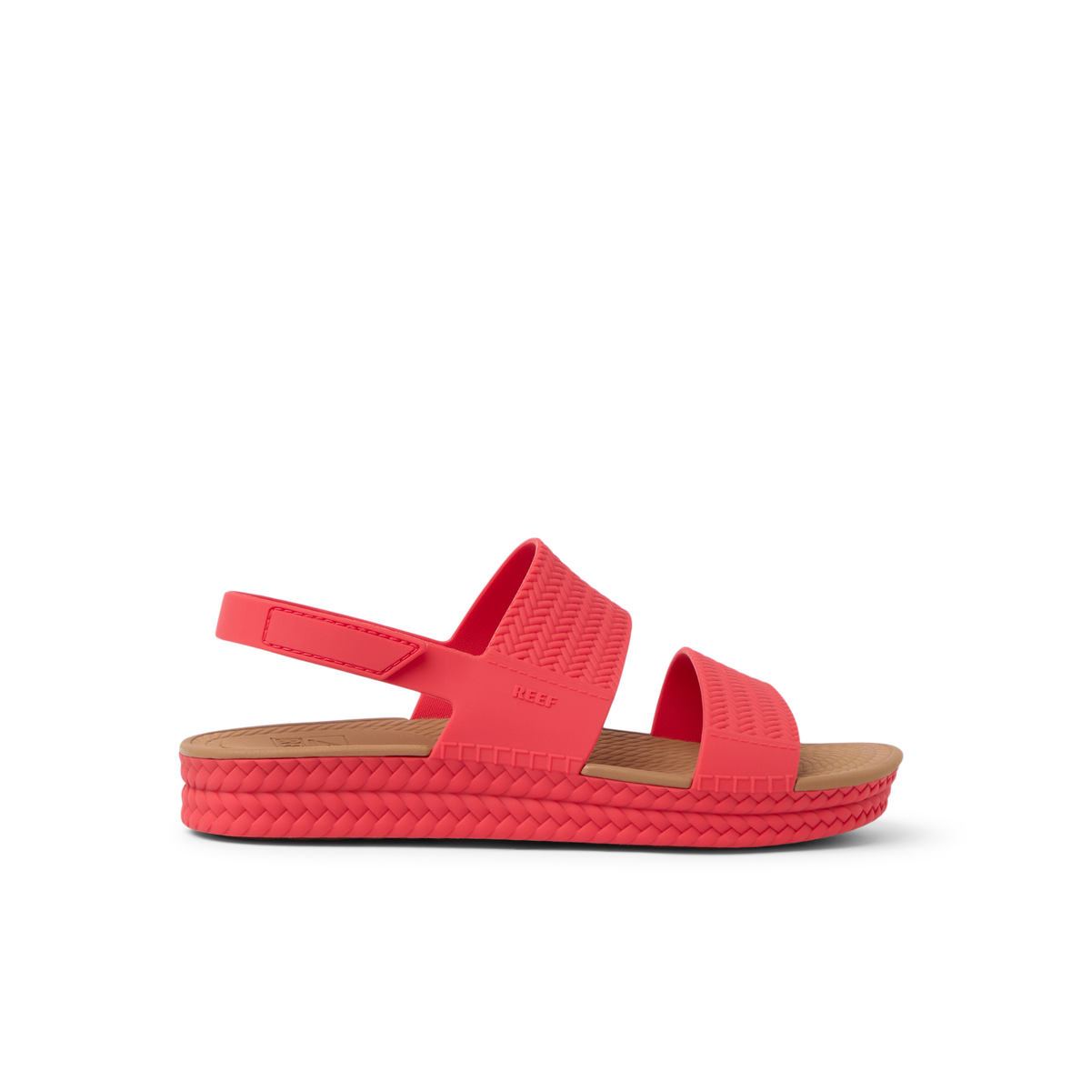 Side view of women's Reef Water Vista sandal in hibiscus red with anatomical arch support and cushioned footbed for beach comfort