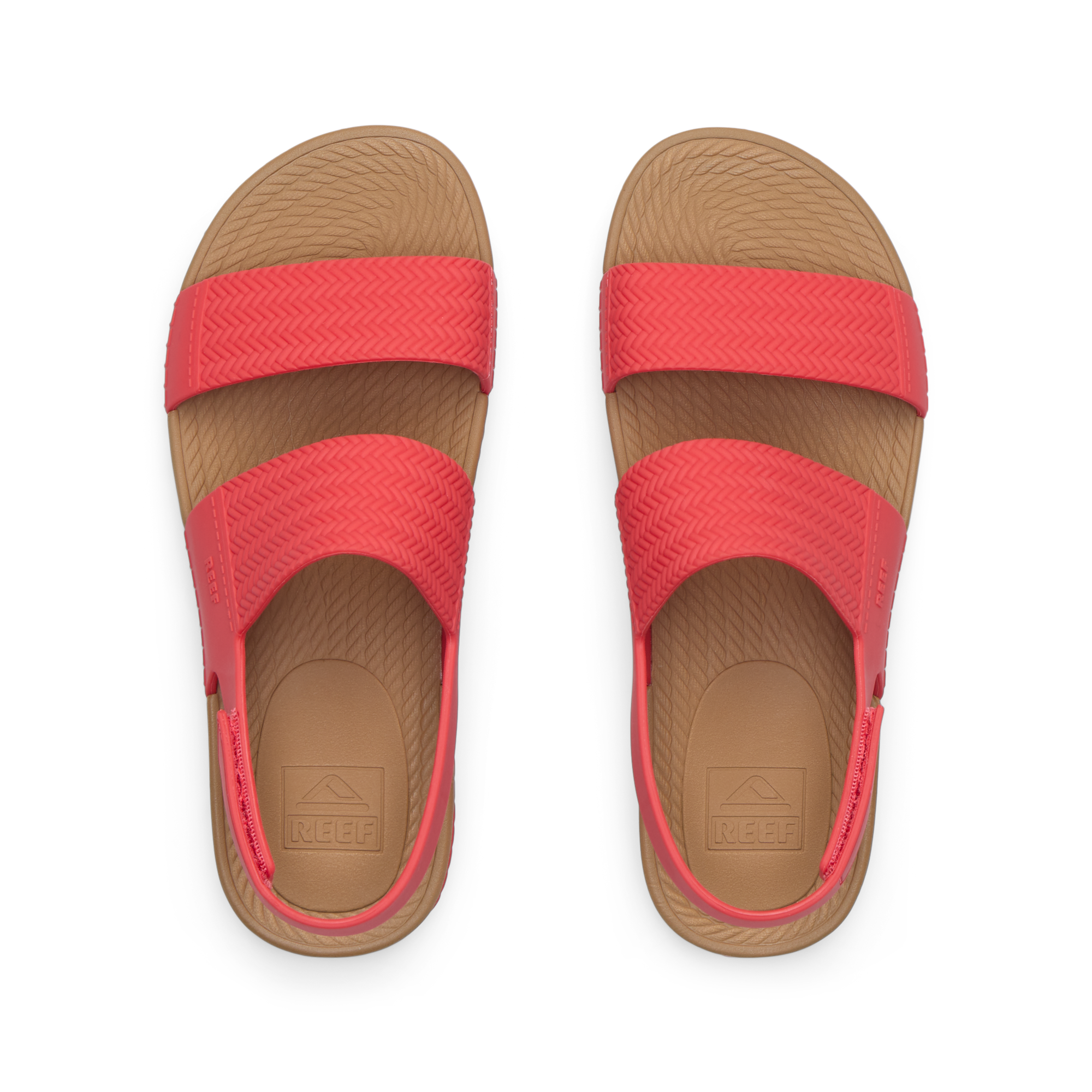 Top view of women's Reef Water Vista coral sandals with arch support and cushioned footbeds, designed for beach comfort.