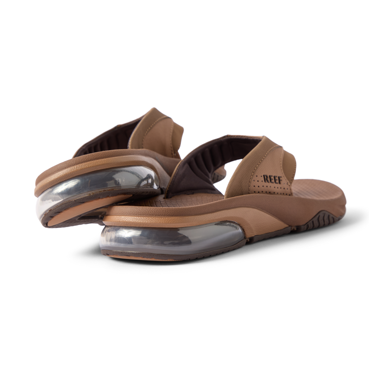 Rear close-up of brown Fanning + men's sandals showing soft-rebound cushioning and anatomical arch support, facing right.