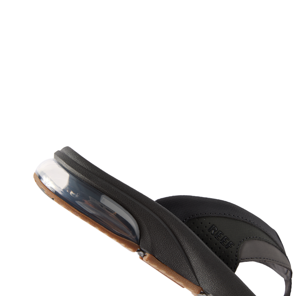 Side view of the black Fanning + sandal showing soft-rebound cushioning and anatomical arch support for comfort.