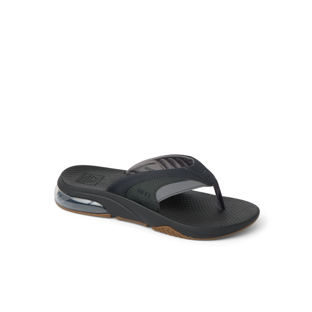 Fanning + men's black and gray flip flop facing right, showing arch support and water-friendly cushioned sole