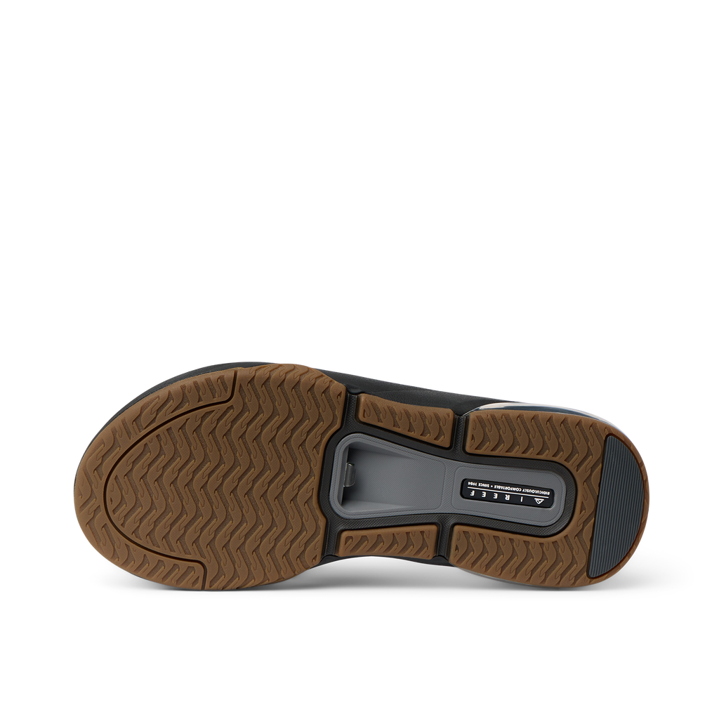 Close-up of the bottom sole of the Fanning + men's shoe in black and gum, showcasing durable, water-friendly traction.