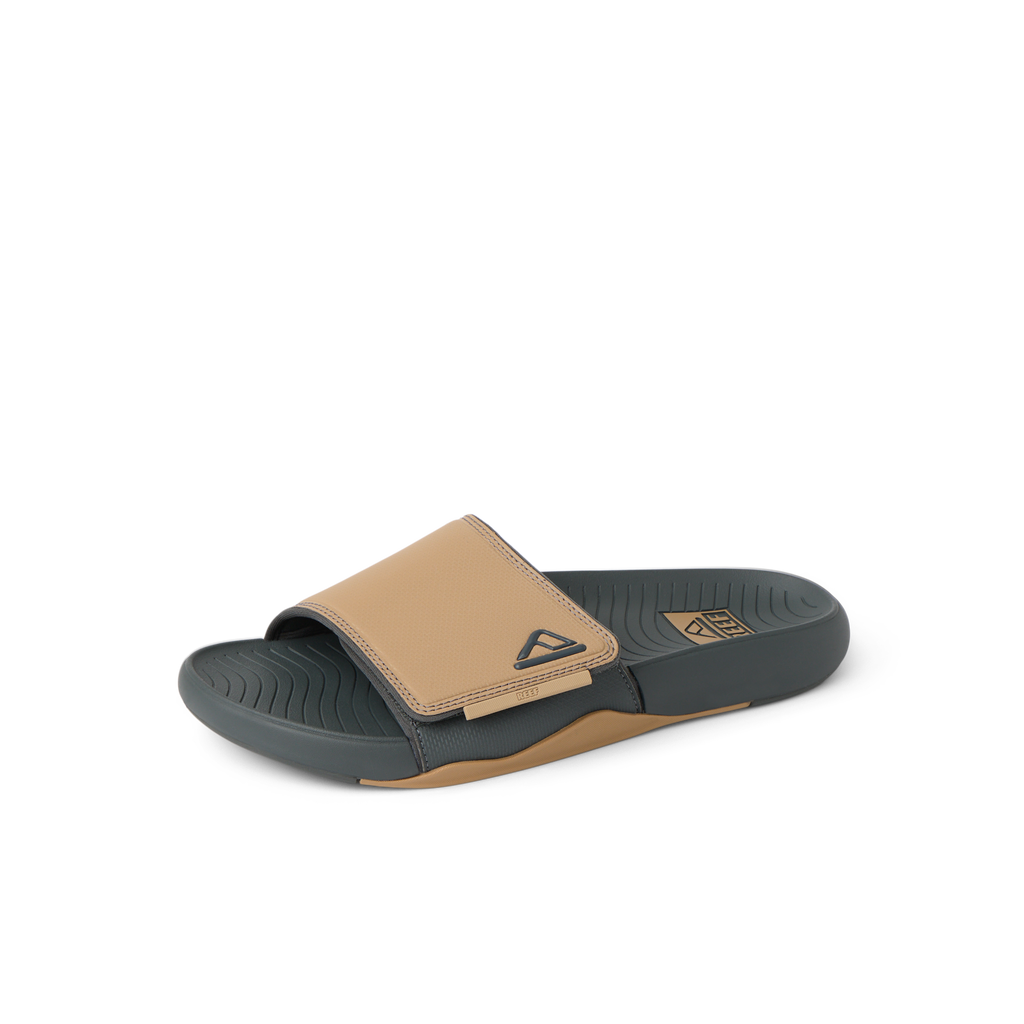 Phantom Slab slide facing right, close-up of water-friendly cushioned footbed and tan strap with arch support.