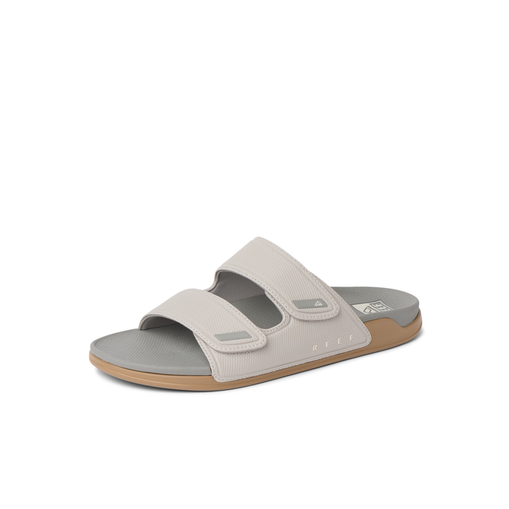 Phantom Tradewind men's sandal facing right, close-up of cushioned sole and ergonomic straps for beach comfort.