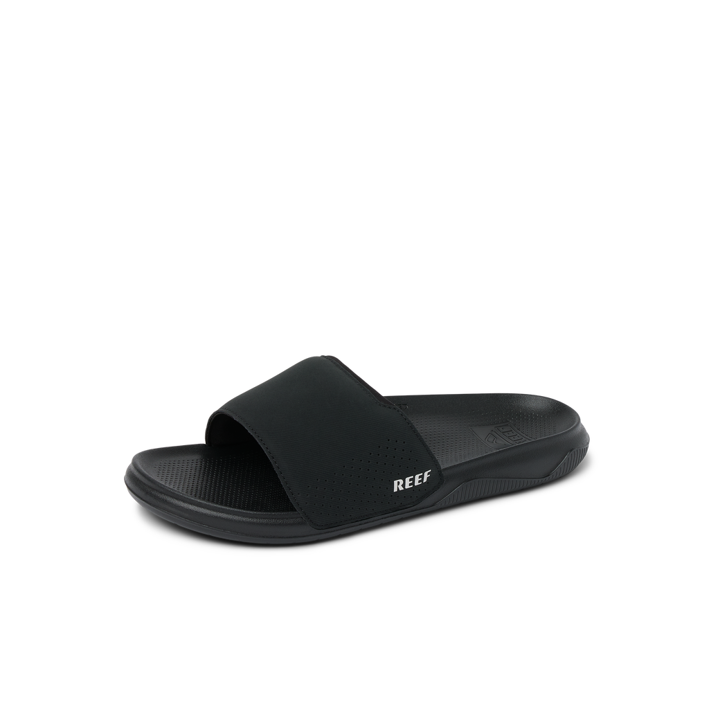 Tailslide black slide sandal facing right, showing top and side, with anatomical arch support and cushioned footbed.