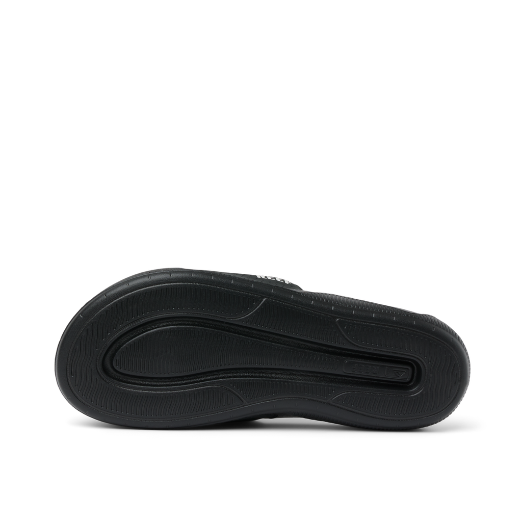 Tailslide black footwear showing the bottom sole facing up with surf-inspired durable, water-friendly comfort features.