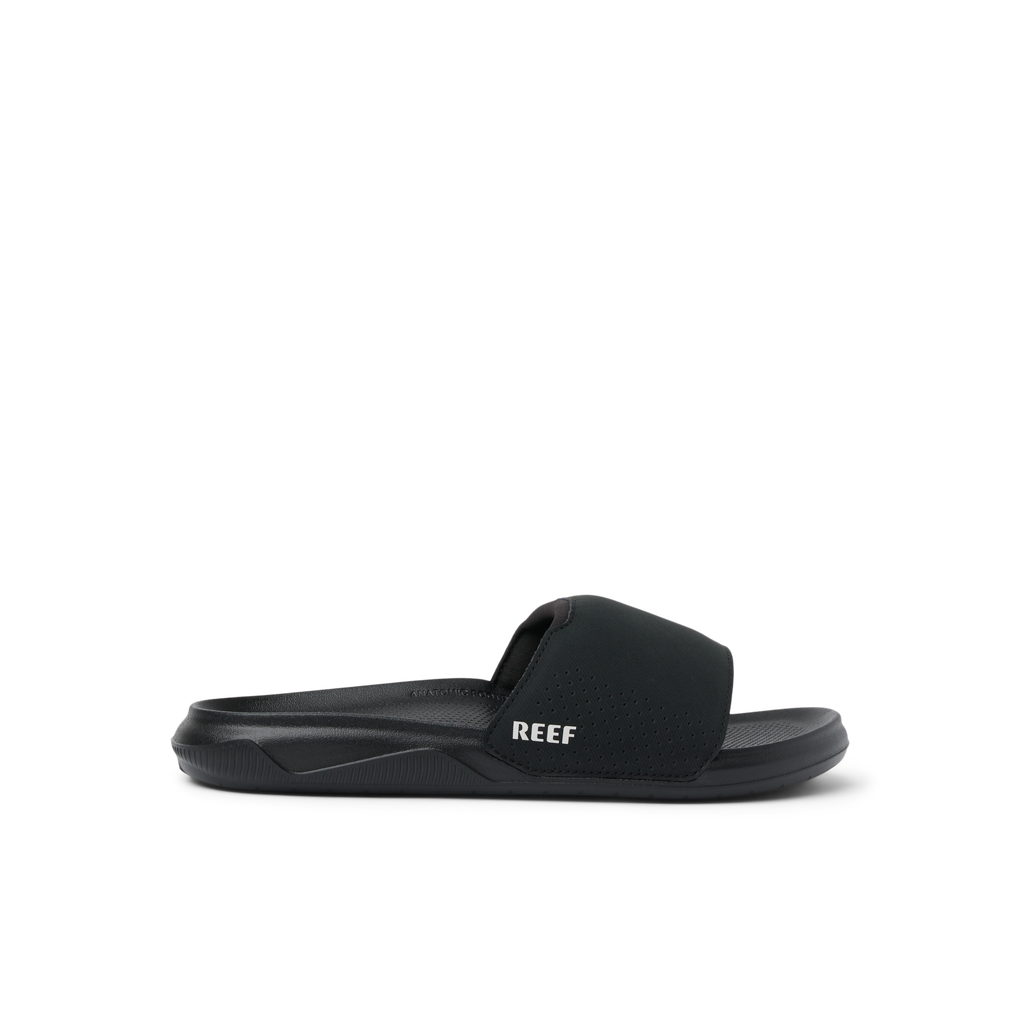 Tailslide men's black slide facing right, showing side profile with anatomical arch support and water-friendly design.