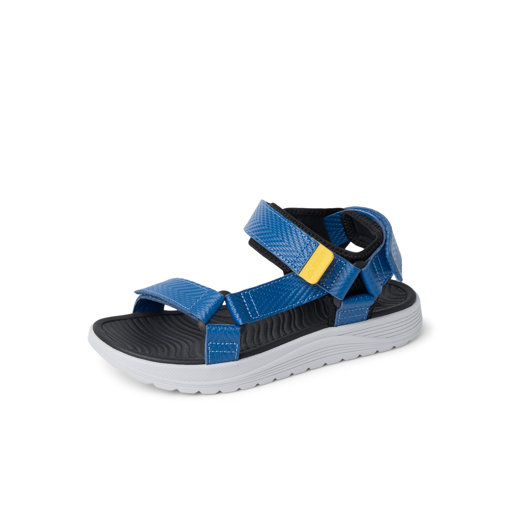 Kids Shoremazing sandal facing left, blue straps with black footbed and white sole, surf-inspired comfort for boys.