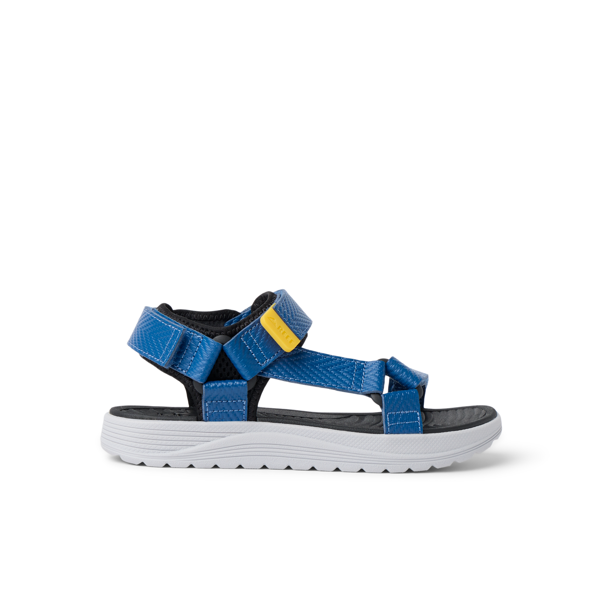 Kids Shoremazing sandal for boys facing right, showing side view with blue straps and white sole, designed for beach comfort.