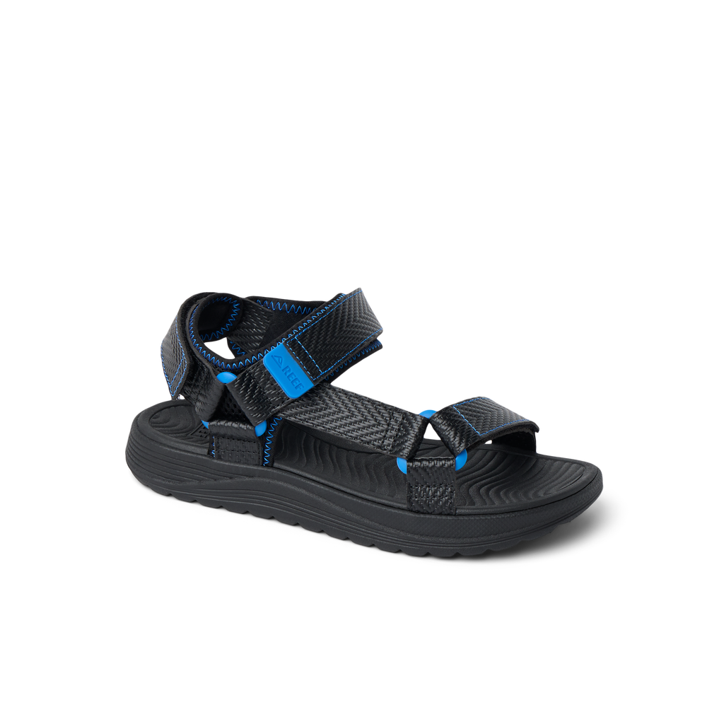 Kids Shoremazing black and blue sandal facing right with adjustable straps and cushioned footbed for comfort and beach use