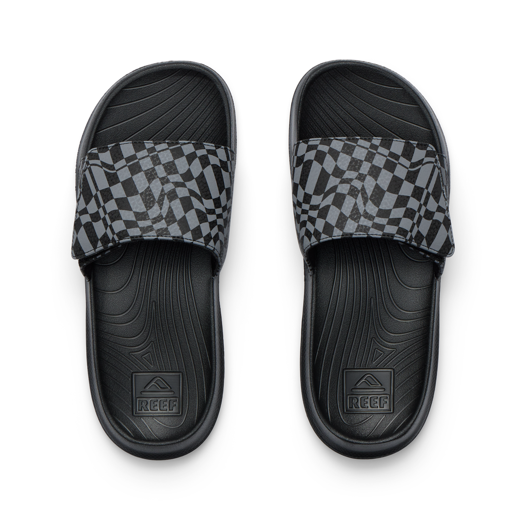 Top view of black Kids Salty Slide with gray checker pattern strap, featuring comfort footbed and anatomical arch support.