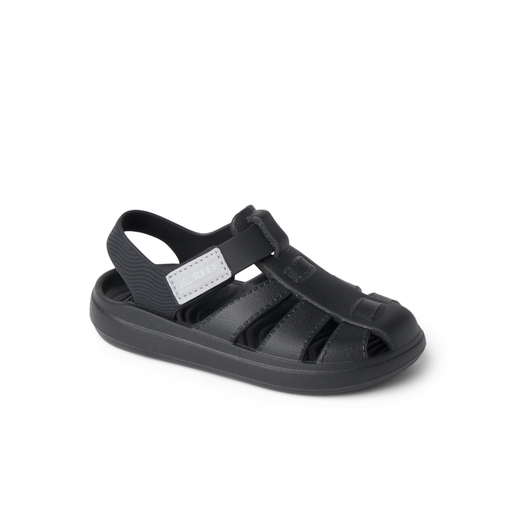 Little Totally Beachin black sandal facing right, showing soft-rebound cushioning and arch support for comfort.