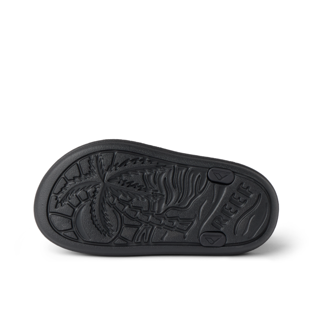 Sole bottom view of Little Totally Beachin boys shoe facing upward with palm tree design, comfort, and water-friendly materials.