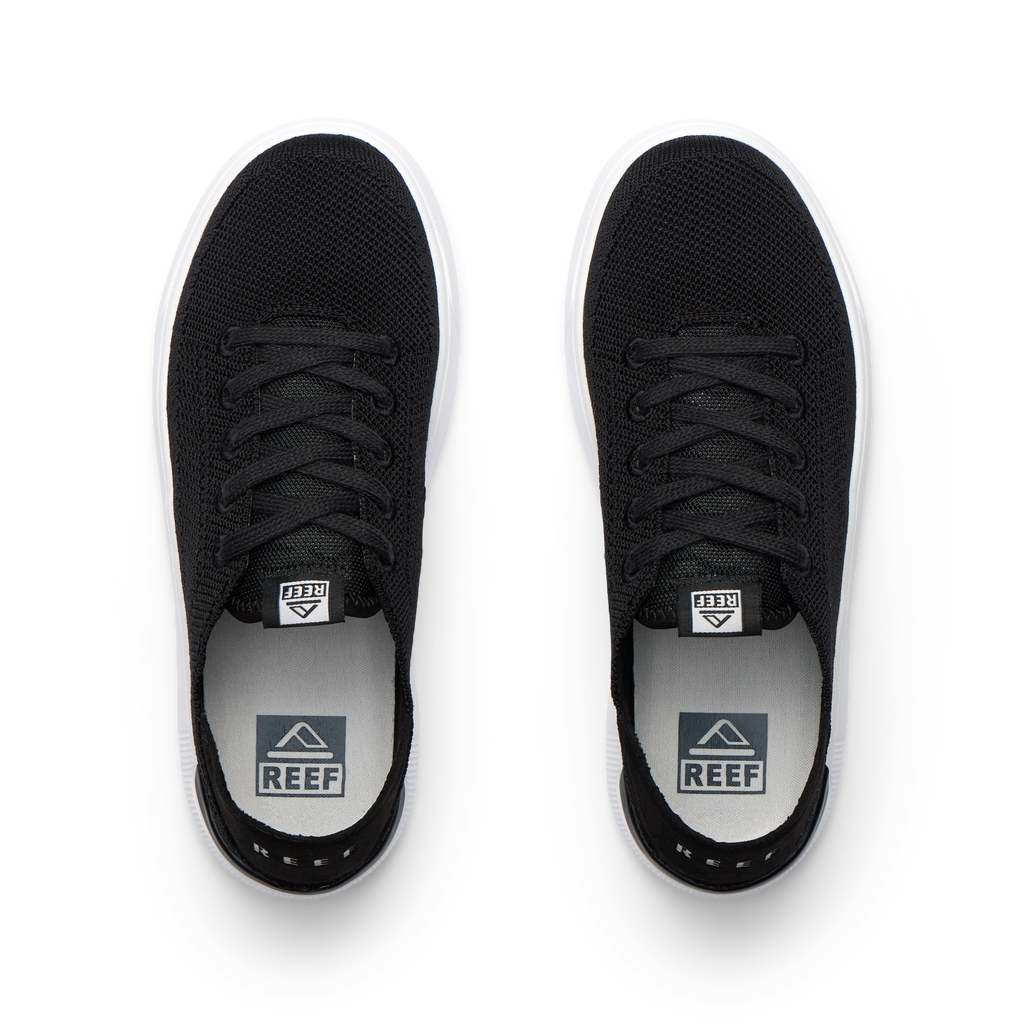 Top view of black Kids Neptune sneakers with breathable knit upper, white sole, and surf-inspired comfort design.