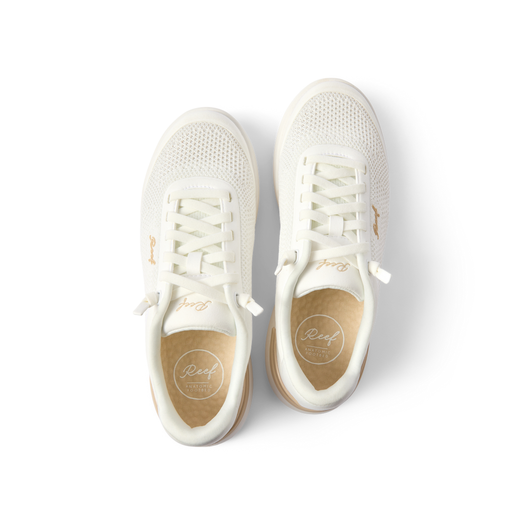 Top-down close-up of white Shoreline Palisades sneakers for women, showing laces and cushioned insole with arch support.