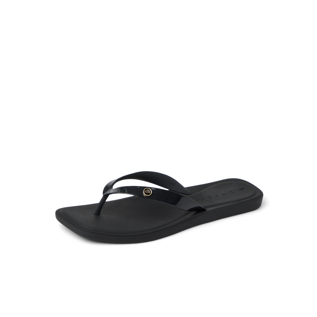 Solaye black women's flip flop facing left, close-up on toe post and cushioned footbed, beach-inspired comfort design.