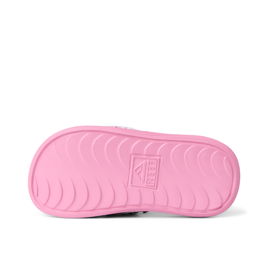 Little Salty Slide showing bottom sole facing up in pink, durable, water-friendly design with anatomical arch support.