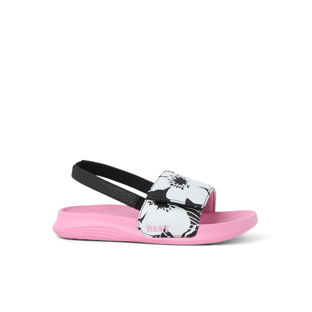 Little Salty Slide sandal for girls facing right, featuring floral strap, pink cushioned sole, and soft arch support.