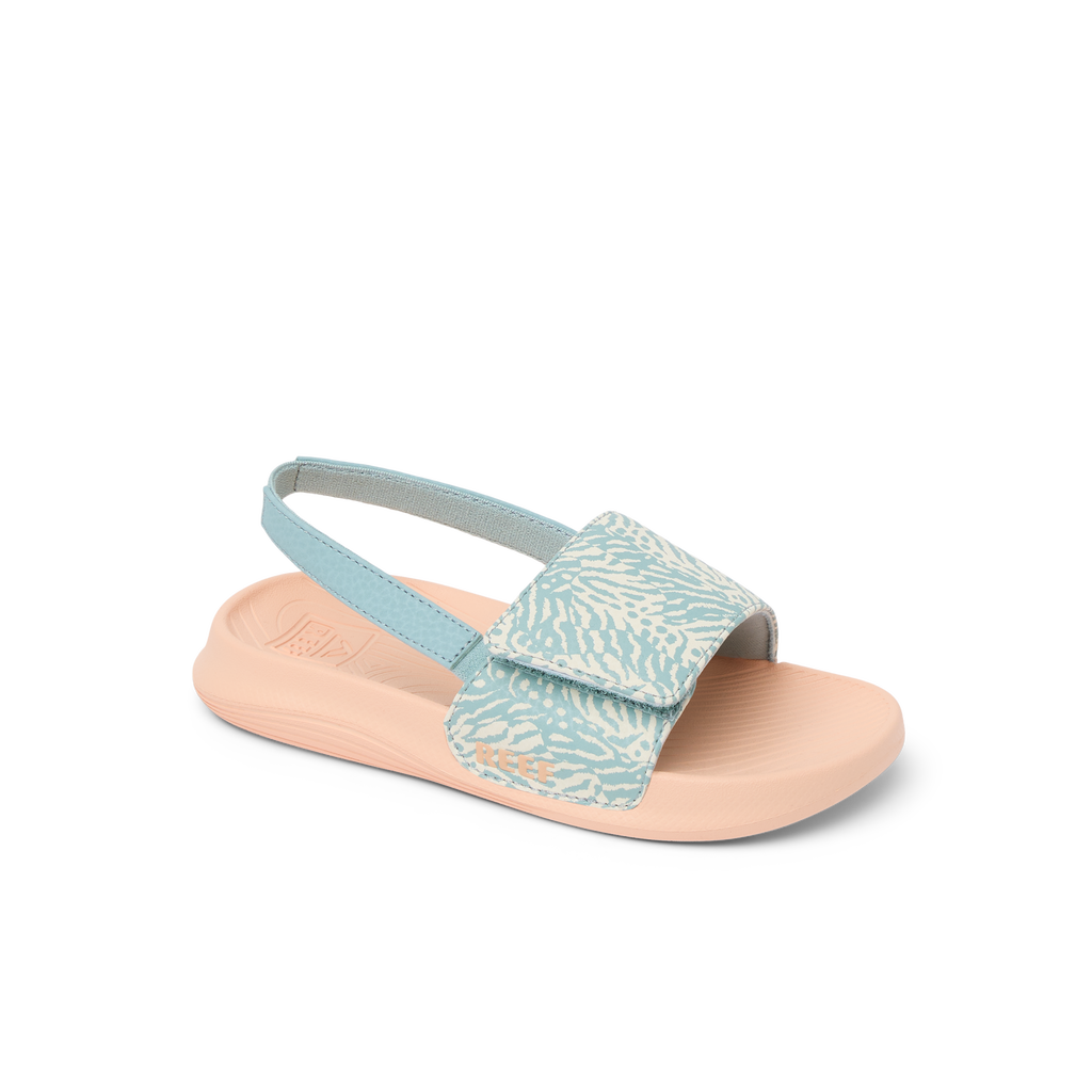 Little Salty Slide sandal for girls facing right, showing side and top with soft cushioning and arch support in blue haze pattern.