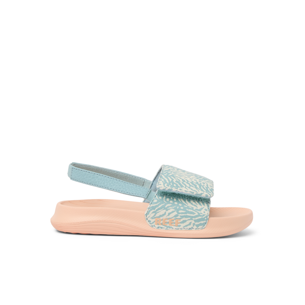 Little Salty Slide sandal for girls facing right, showing side view with blue patterned strap and cushioned sole for comfort.