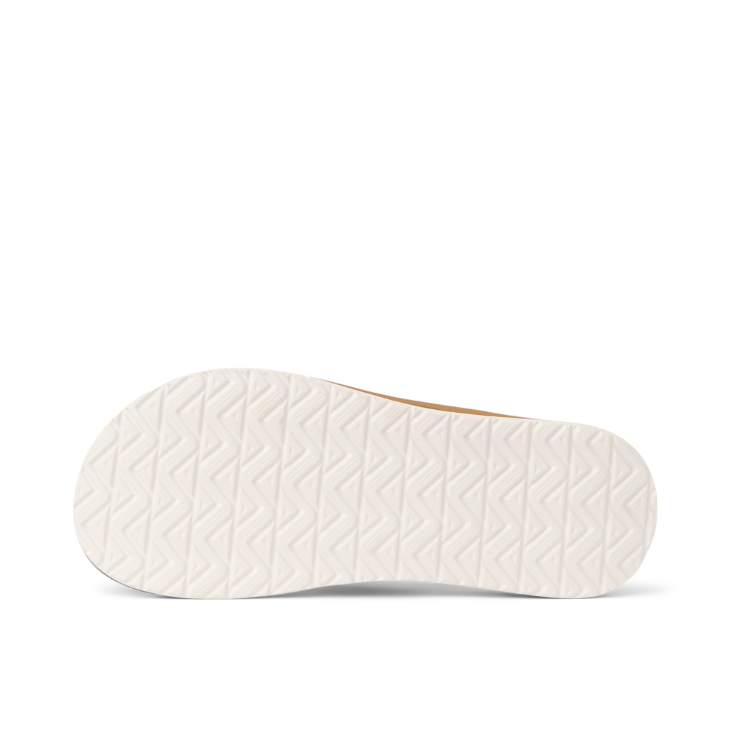Nox men's footwear showing close-up of the white rubber outsole with patterned traction, beach-inspired comfort design.