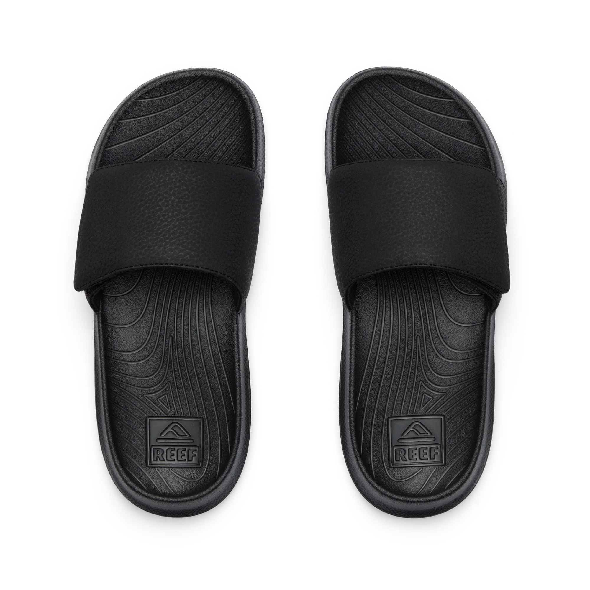Kids Salty Slide top view showing black water-friendly slides with anatomical arch support and soft cushioning for boys.