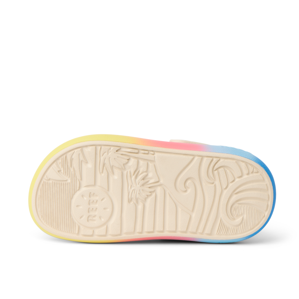 Little Rio Slide sole facing up showing textured bottom with palm tree and wave design for beach comfort and durability.