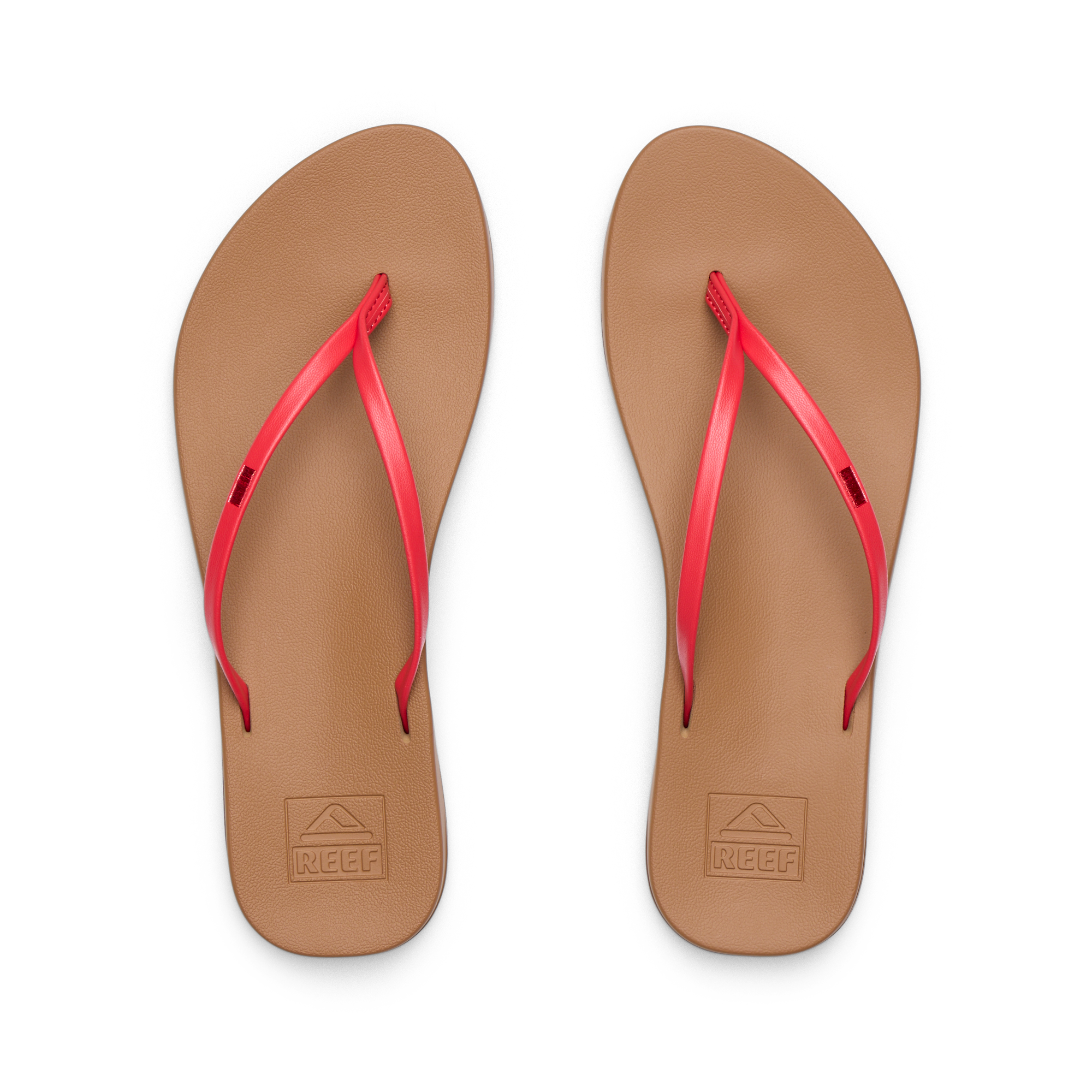 Pair of Cushion Slim women's flip-flops facing up showing tan footbed with red straps, water-friendly and comfort-focused design.