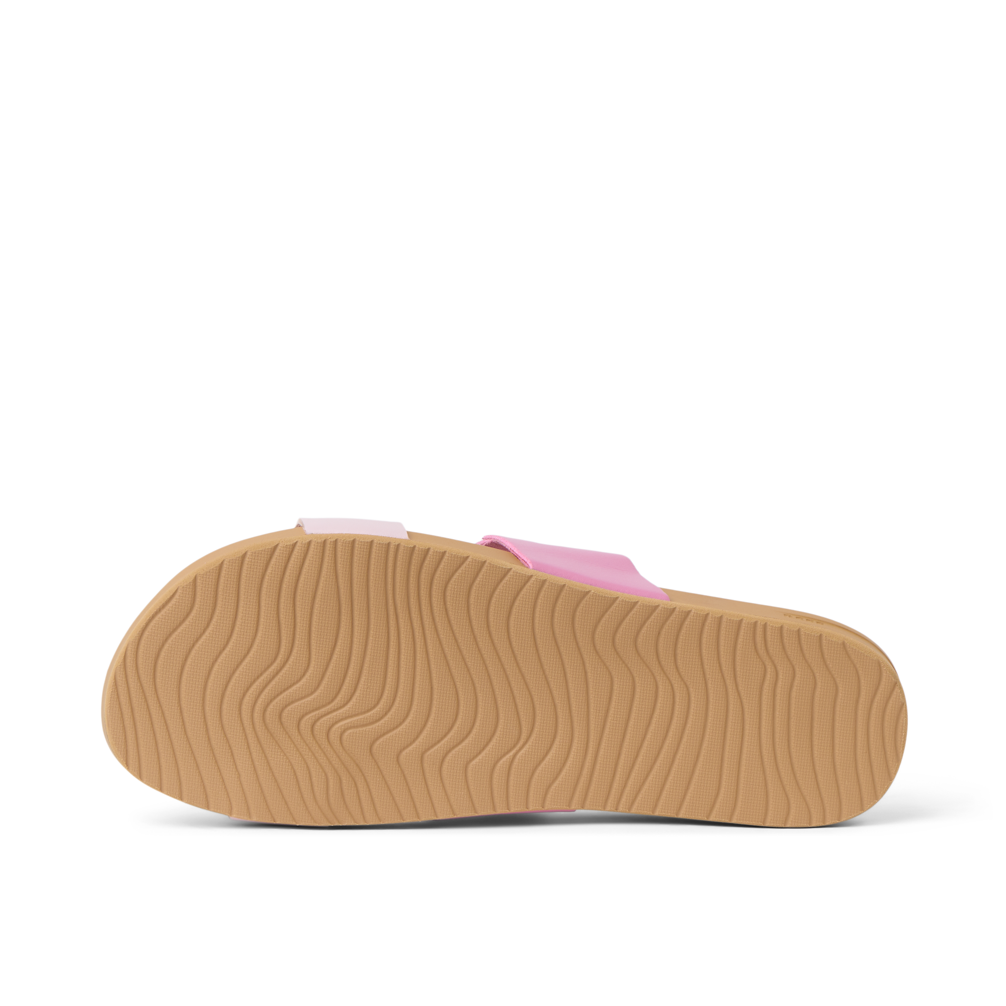 Cushion Vista women's sandal showing outsole facing up with wave-patterned grip, designed for beach comfort and support.
