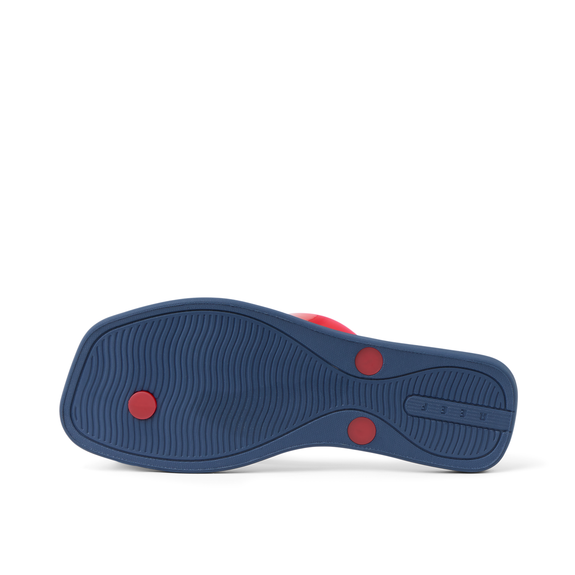 Solaye women's footwear showing outsole in navy blue with red circular accents, surf-inspired comfort design