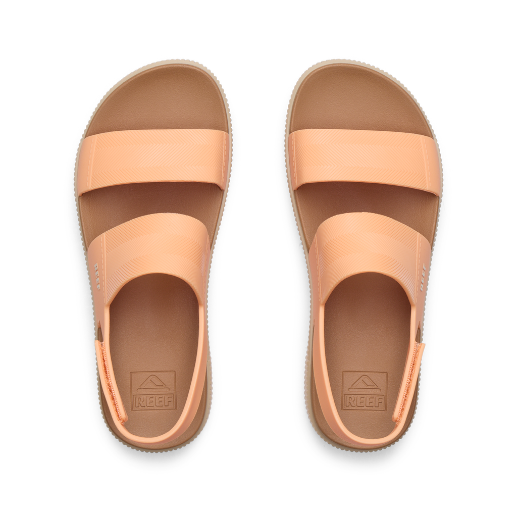 Top view of Water Vista Higher women's sandals in soft orange, showing straps and cushioned footbeds, designed for all-day comfort.