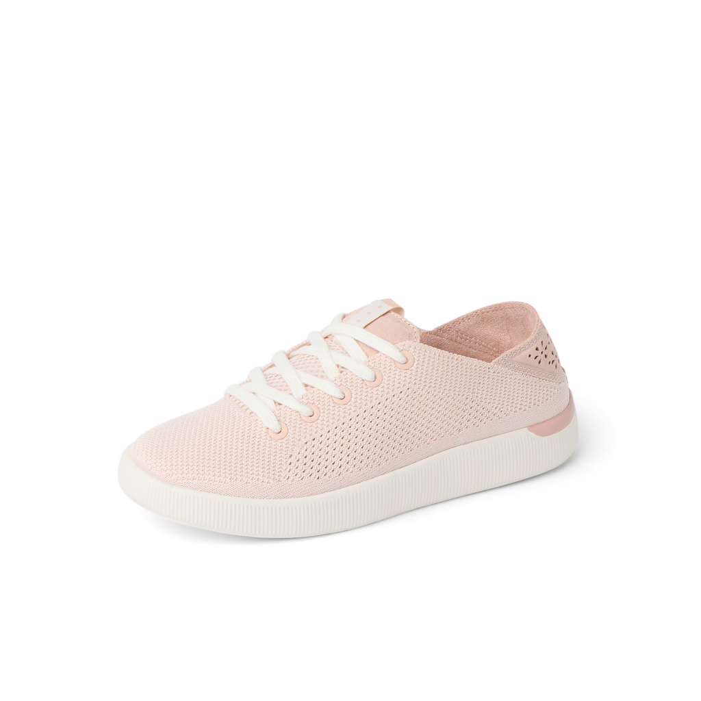 Reef Neptune women’s sneaker facing right with pink breathable knit upper and cushioned sole for all-day comfort.