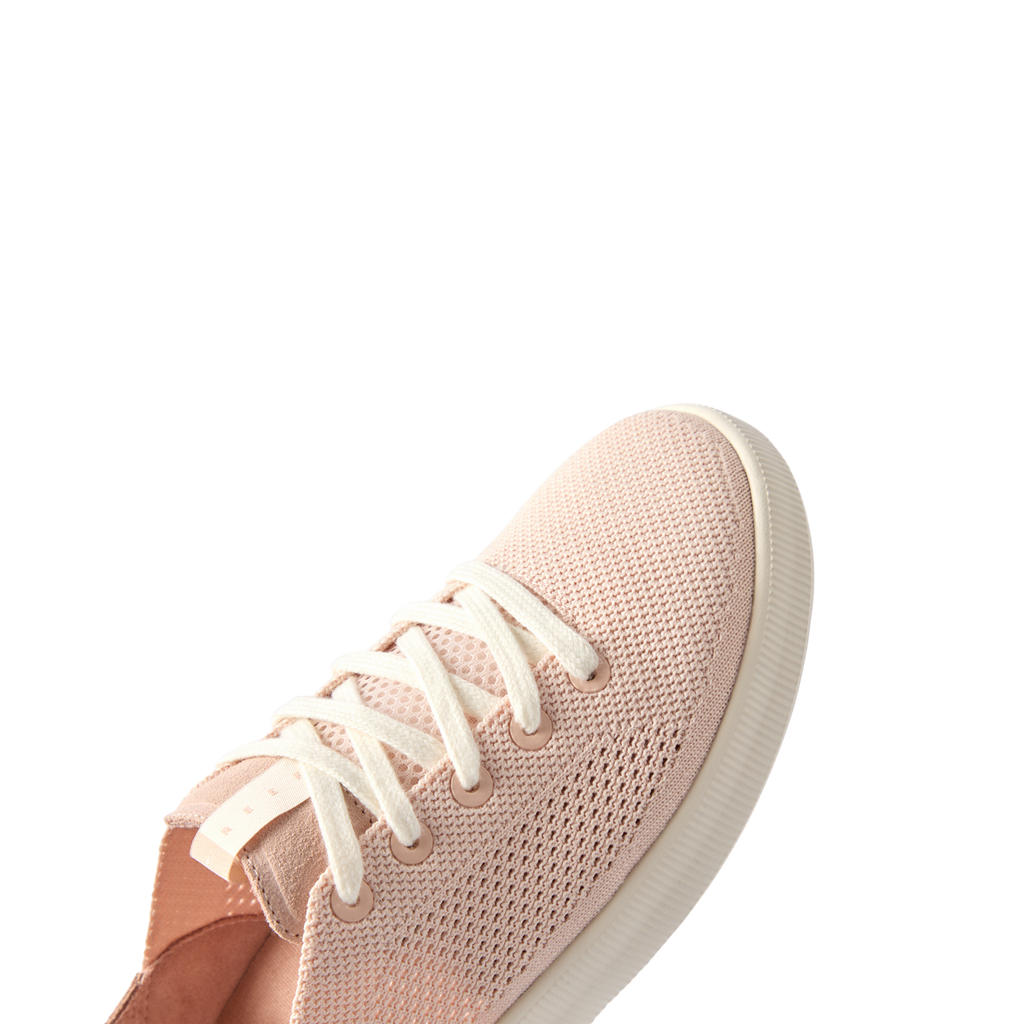 Reef Neptune sneaker facing left, close-up of front and toe area with breathable rose blossom fabric and comfort features.