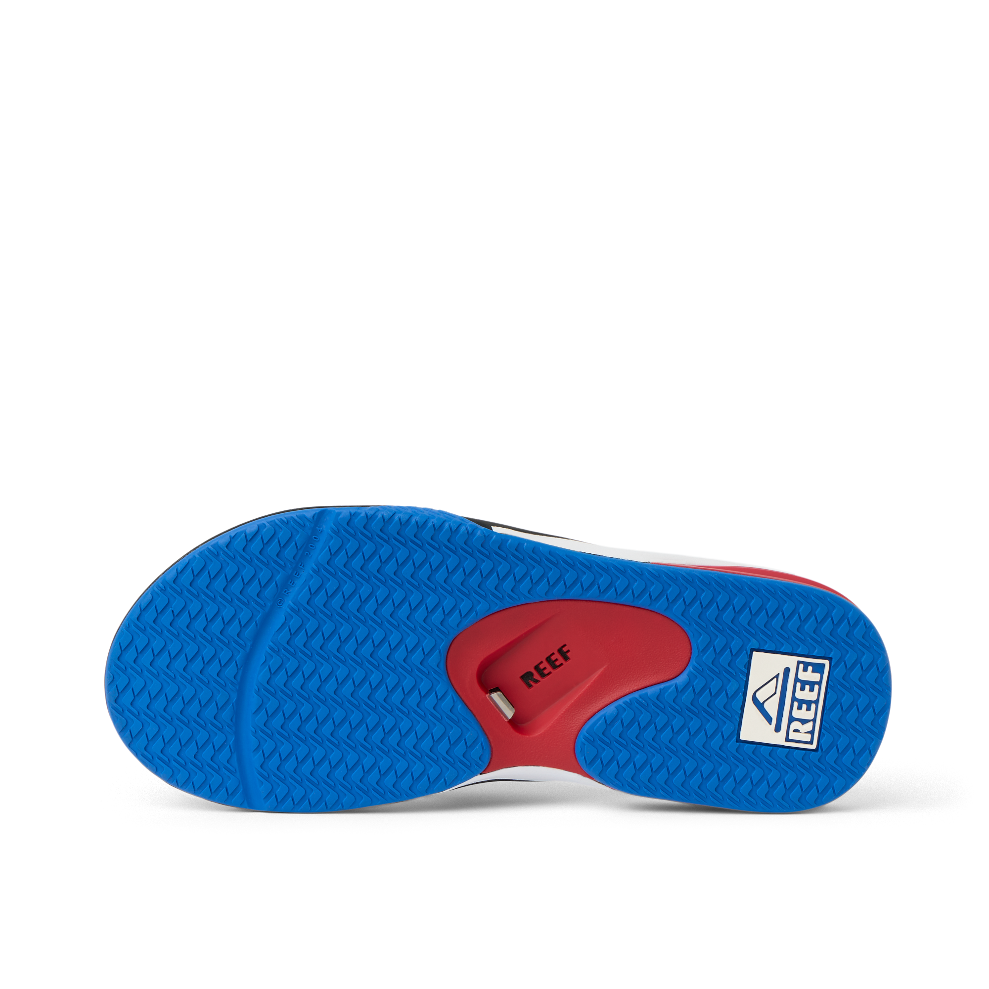 Fanning men's shoe sole facing up, showing blue textured grip and red arch support with REEF branding.