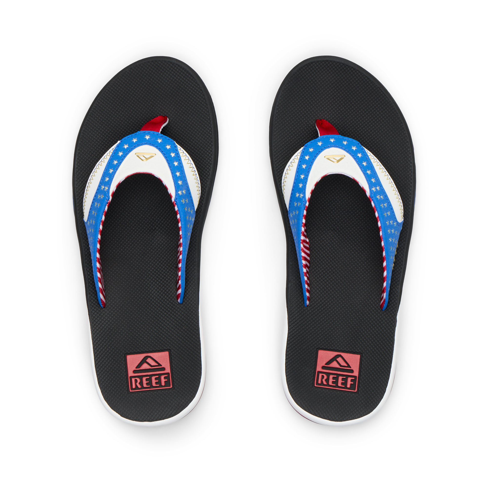 Pair of Fanning men's flip flops facing upward, featuring American flag design straps and cushioned soles for beach comfort.