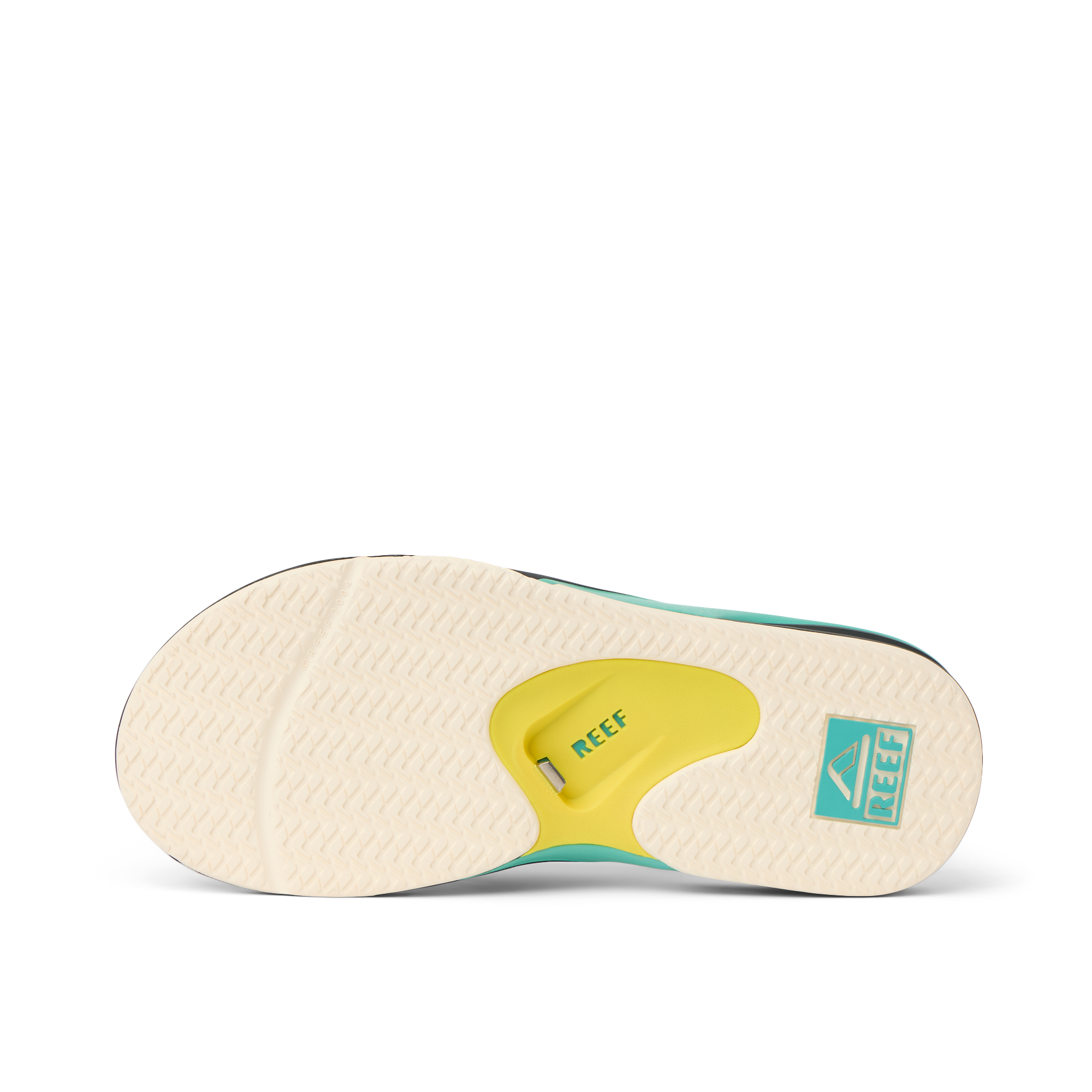 Fanning outsole facing up showing slip-resistant tread and arch cushioning with REEF branding in teal and yellow
