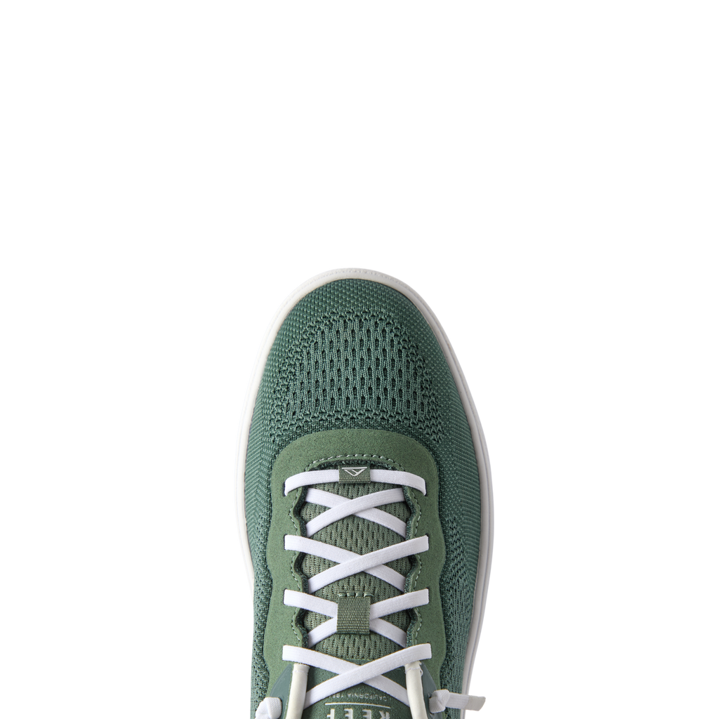 Top view close-up of the green Shoreline Del Mar sneaker with white laces, featuring breathable mesh and comfort-focused design.
