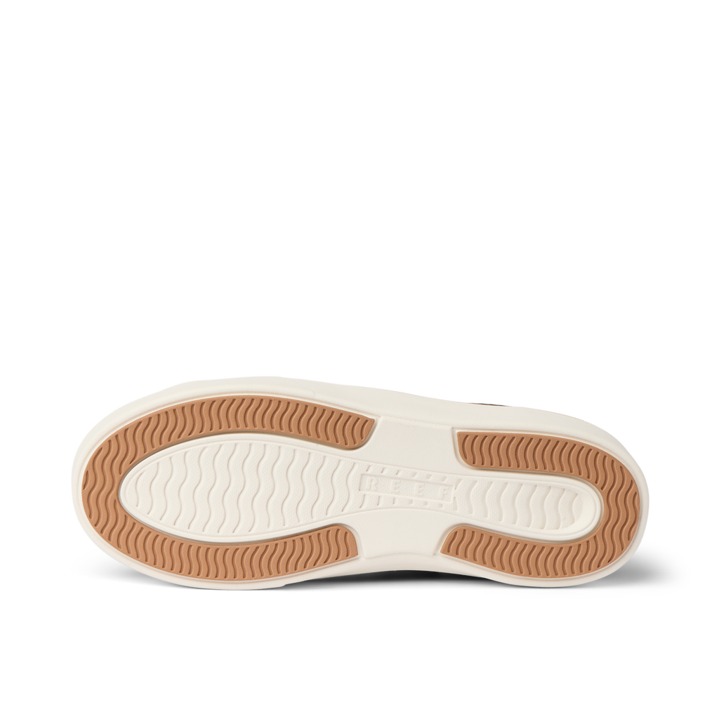 Lay Day Lite women's shoe showing outsole facing up with textured grip for durability and comfort, beach-inspired design.