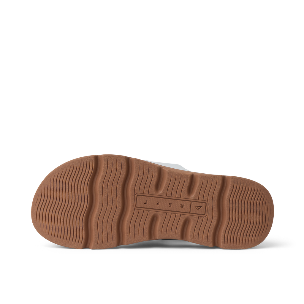 Vista Luxe Thea women's shoe showing brown sole facing upward, highlighting durable, comfort-focused surf-inspired design.