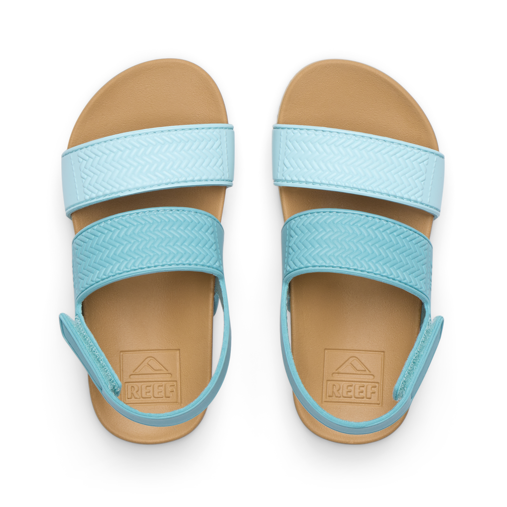 Top view of Little Water Vista girls' light blue sandals with adjustable straps and cushioned footbeds for beach comfort.