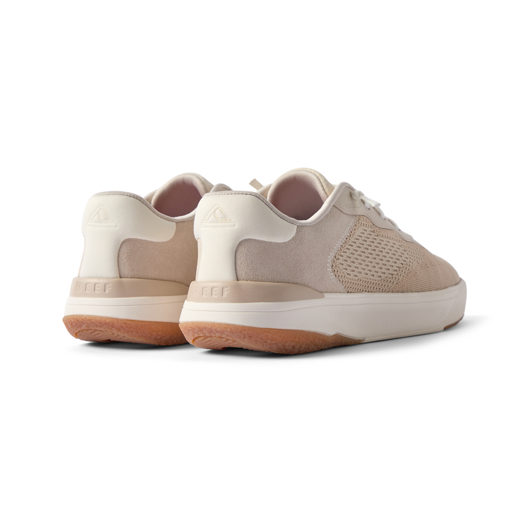Pair of Shoreline Del Mar men's shoes in light tan facing backward showing heel and side details with cushioning and arch support.