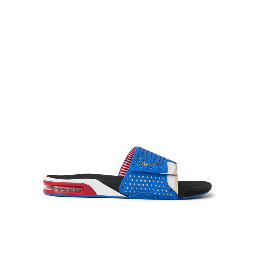 Fanning Slide facing right, showing side profile of blue and red breathable slide with cushioned sole and arch support.