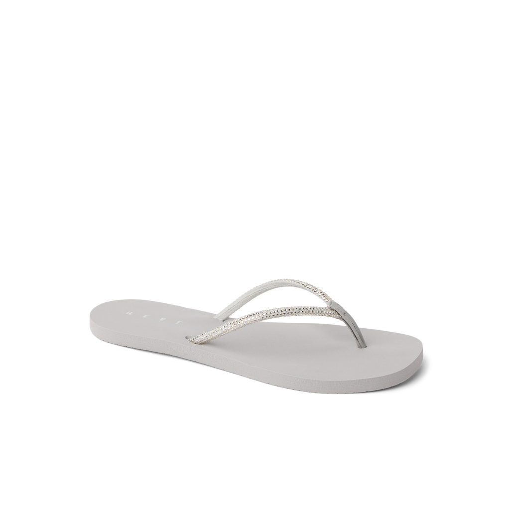 Bliss Bling Fling women's sandal facing left, close-up of cushioned sole and silver straps for beach comfort